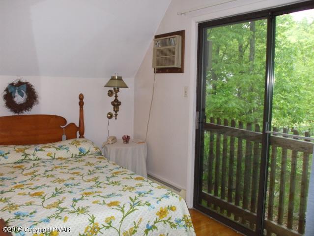 18 Cherry Ridge Road Bushkill, PA 18324 - Photo 11 of 16 a bedroom with a bed and a large window