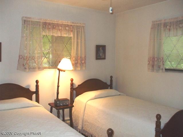 18 Cherry Ridge Road Bushkill, PA 18324 - Photo 12 of 16 a bedroom with a bed and a window