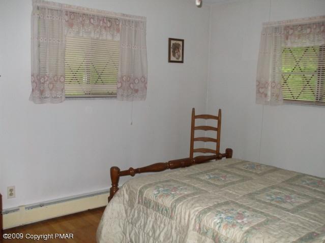 18 Cherry Ridge Road Bushkill, PA 18324 - Photo 13 of 16 a bedroom with a bed and a window