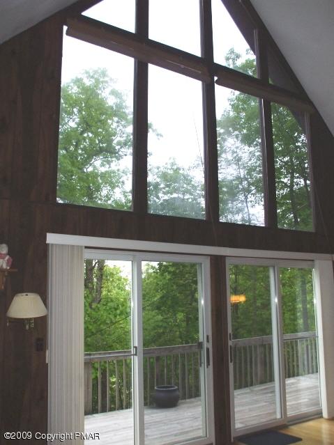 18 Cherry Ridge Road Bushkill, PA 18324 - Photo 5 of 16 a view of a room with a large window and wooden floor