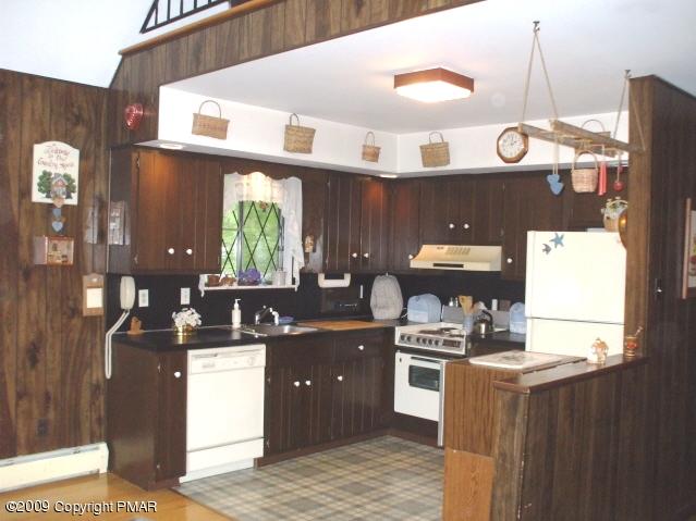 18 Cherry Ridge Road Bushkill, PA 18324 - Photo 8 of 16 a kitchen with granite countertop a sink and a stove