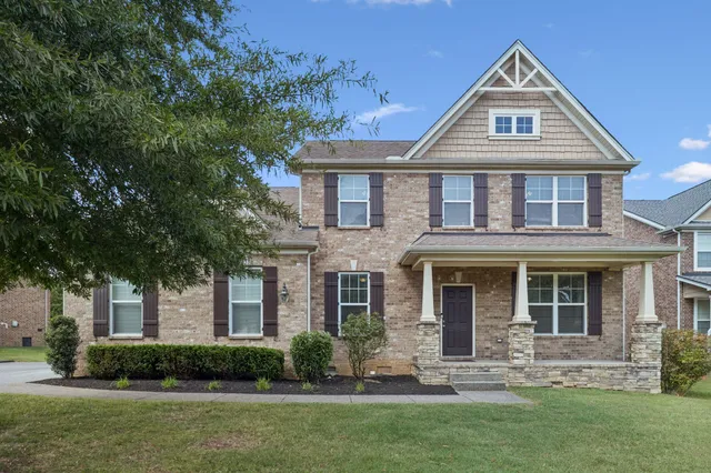 front view of a house with a yard