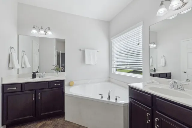 a kitchen with a table chairs and a refrigerator