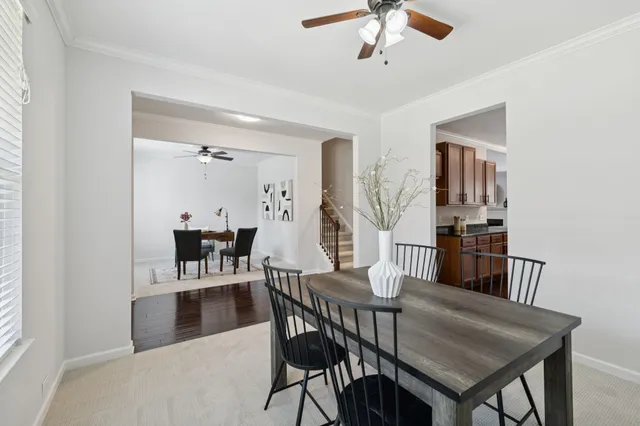 a view of a dining room with furniture and wooden floor