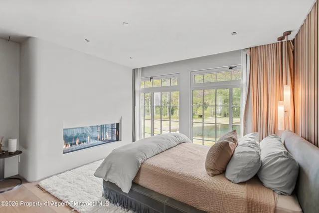 a bathroom with a granite countertop sink and a window