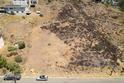 an aerial view of house with yard