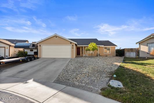 552 Spur Court Fernley, NV 89408 - Photo 2 of 46 a front view of a house with garden
