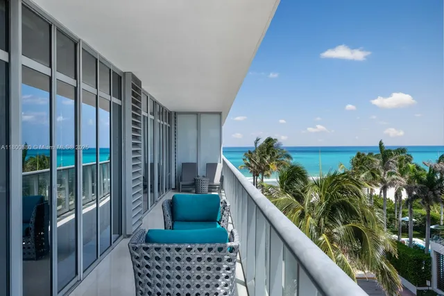 a view of balcony with furniture