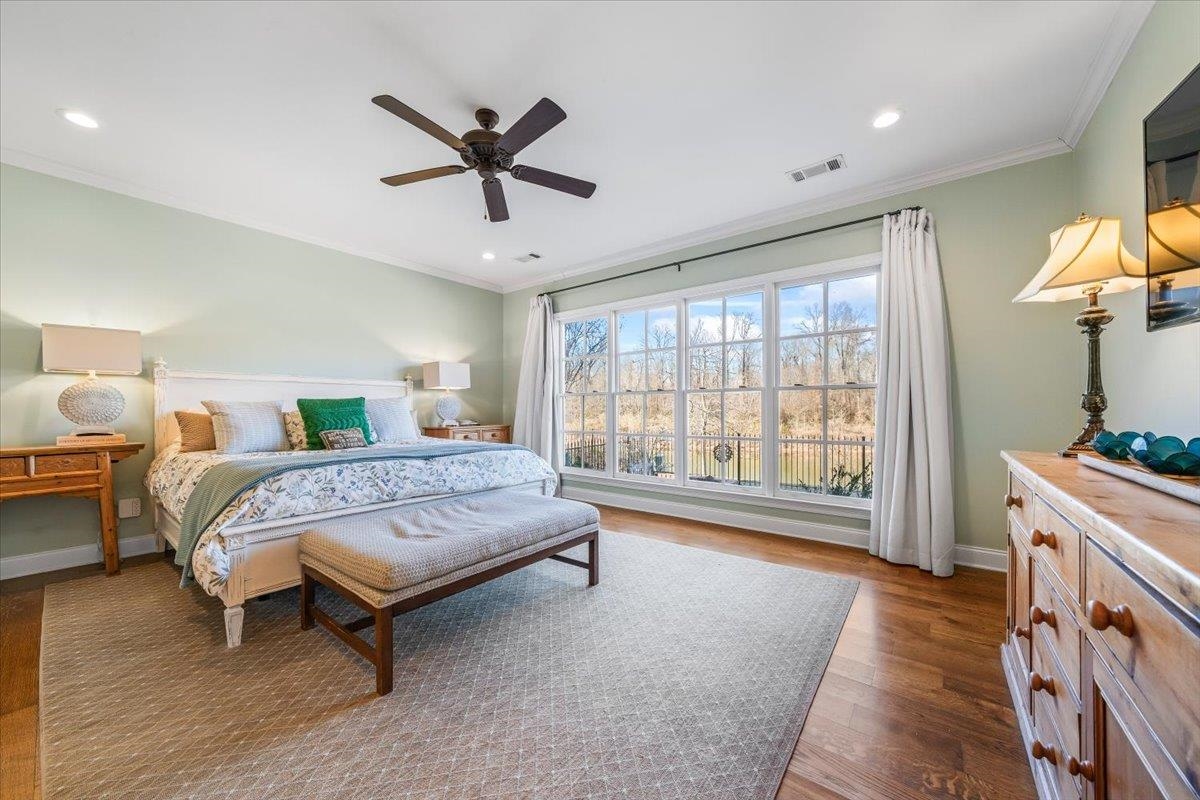9074 Baynard Loop North Germantown, TN 38139 - Photo 14 of 36 a bedroom with a bed and a chandelier