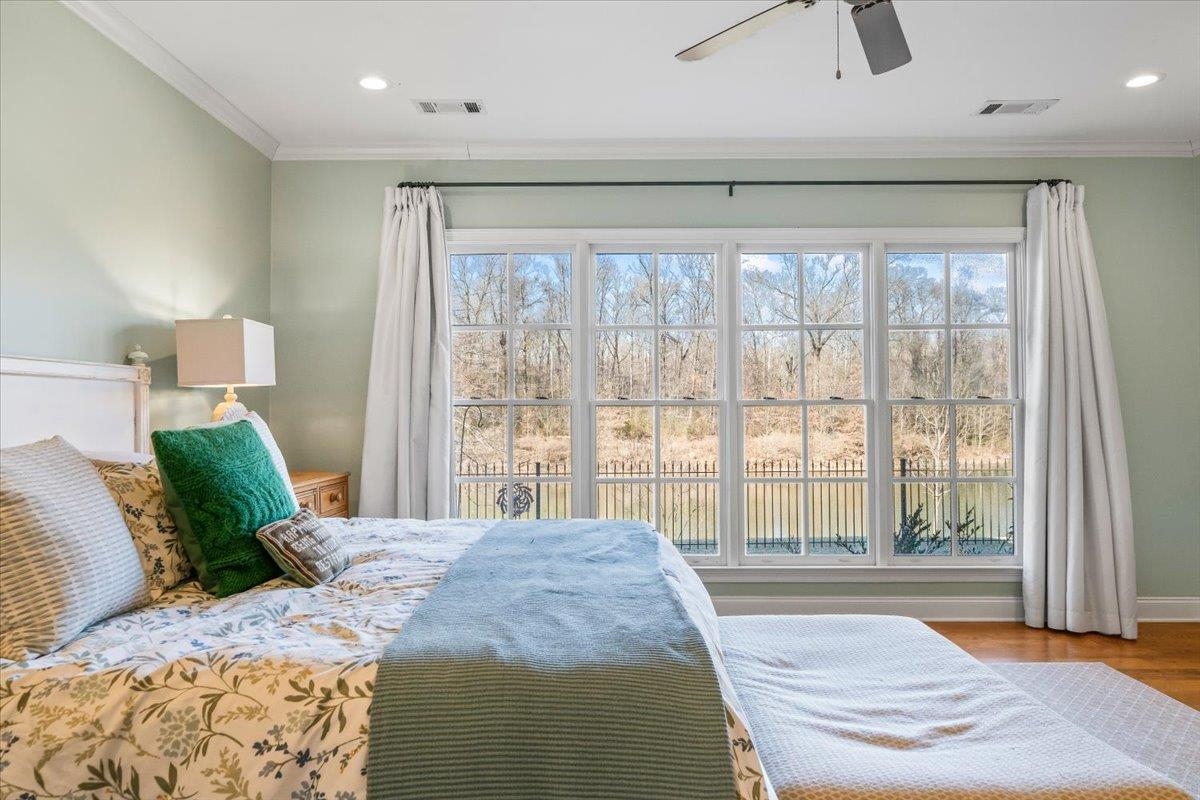 9074 Baynard Loop North Germantown, TN 38139 - Photo 16 of 36 a spacious bedroom with a large bed and a large window