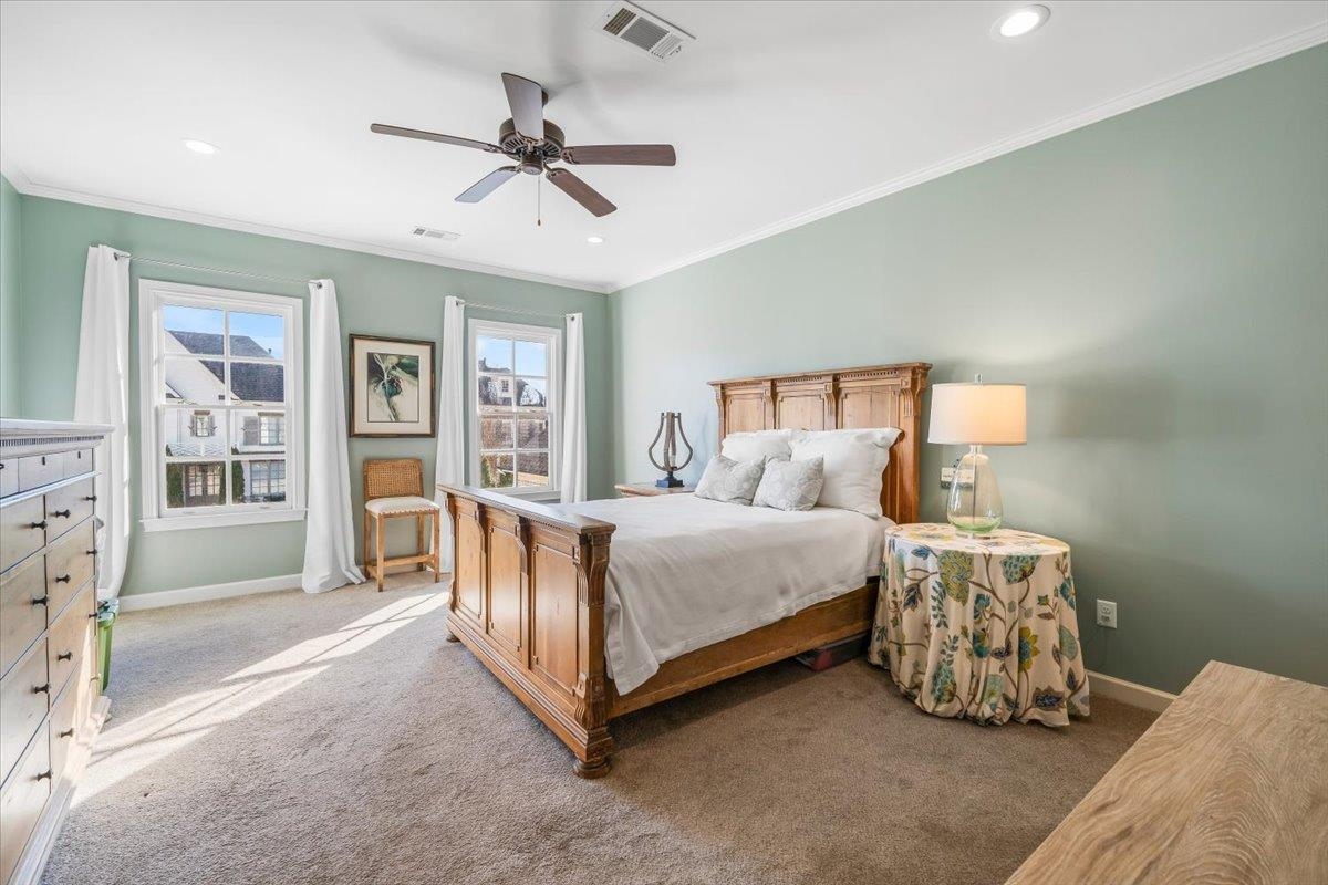 9074 Baynard Loop North Germantown, TN 38139 - Photo 18 of 36 a spacious bedroom with a bed and a chandelier