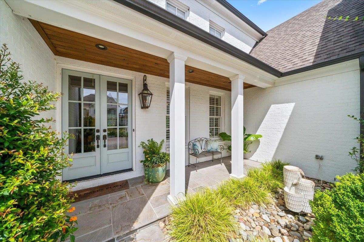 9074 Baynard Loop North Germantown, TN 38139 - Photo 2 of 36 a front view of a house with a large window and potted plants