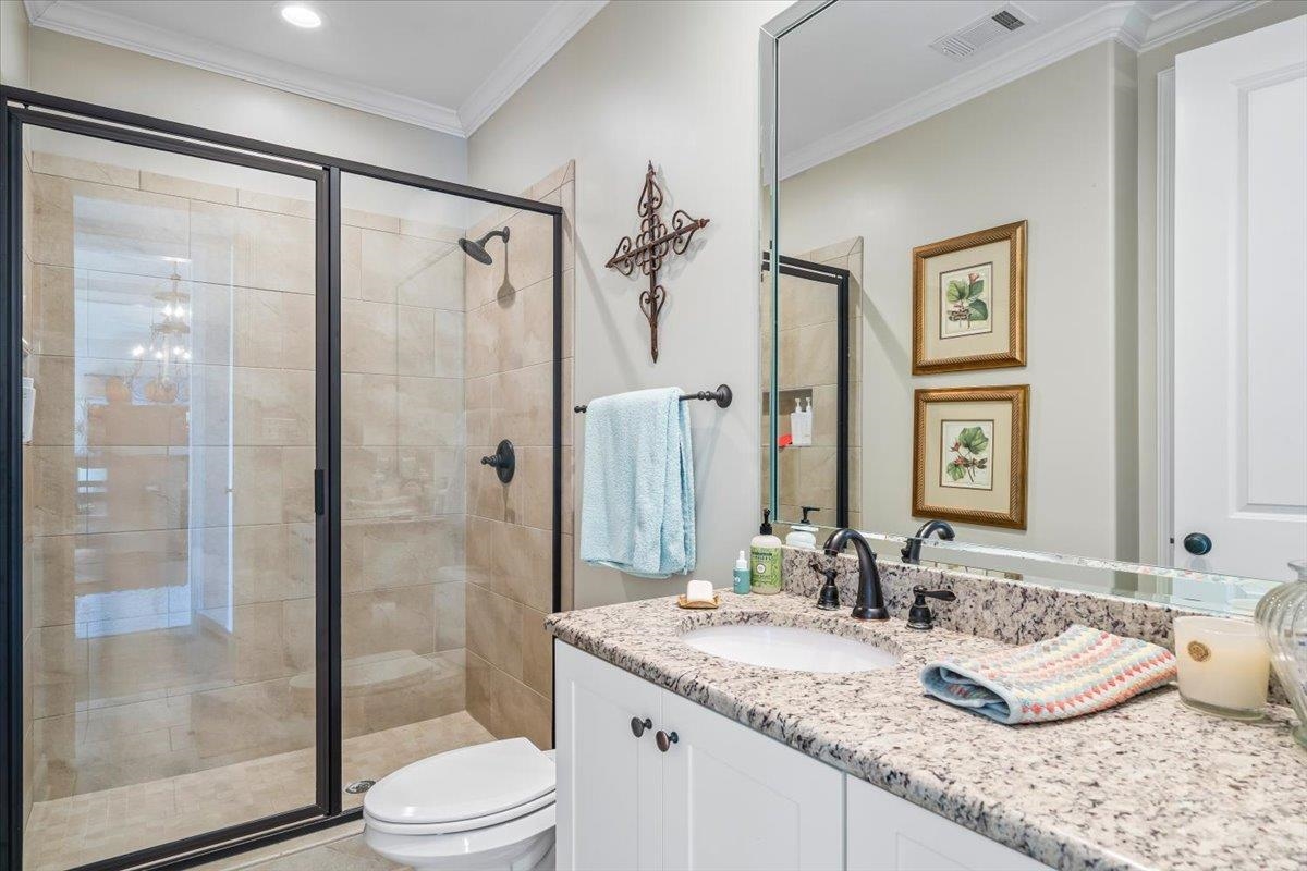 9074 Baynard Loop North Germantown, TN 38139 - Photo 21 of 36 a bathroom with a granite countertop sink toilet and shower