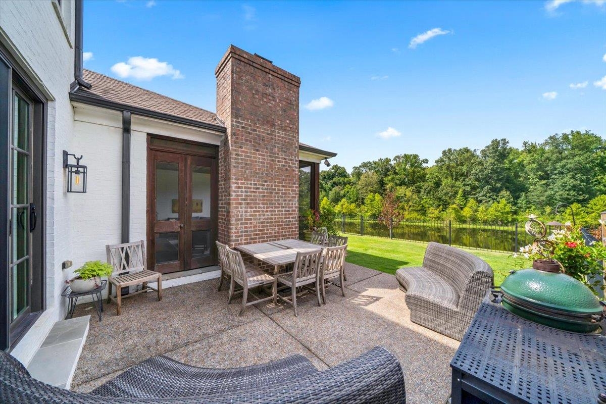 9074 Baynard Loop North Germantown, TN 38139 - Photo 30 of 36 a view of a patio with couches chairs and a table and chairs with garden view