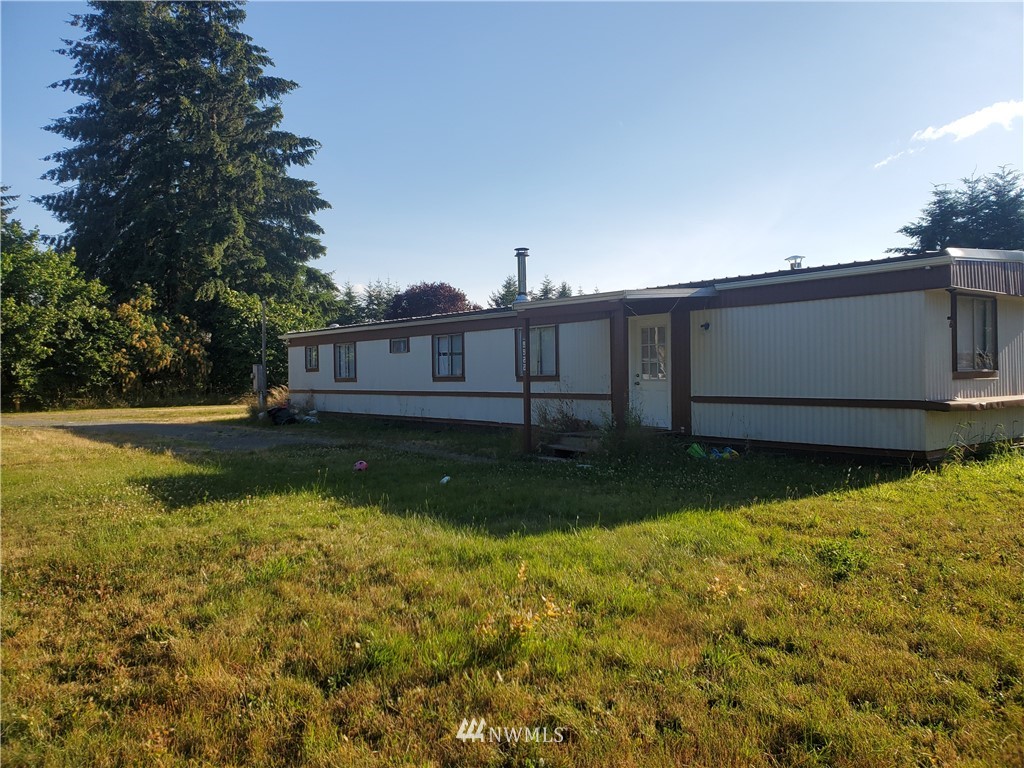 9922 180th Way Southwest Rochester, WA 98579 - Photo 1 of 15 a view of backyard with green space