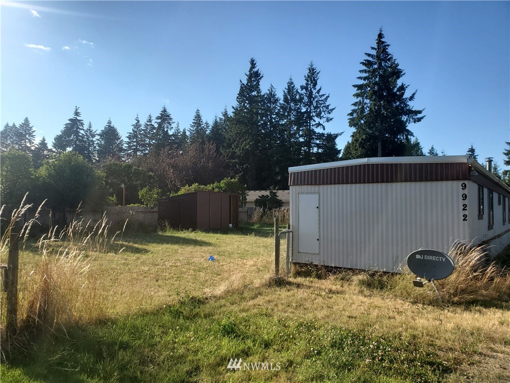 9922 180th Way Southwest Rochester, WA 98579 - Photo 2 of 15 a backyard of a house