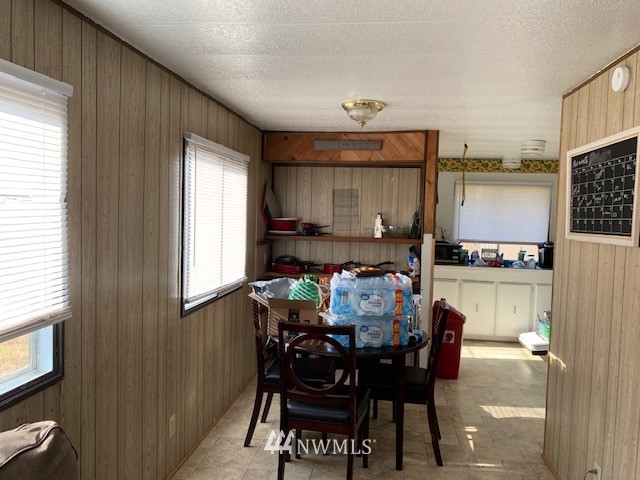 9922 180th Way Southwest Rochester, WA 98579 - Photo 6 of 15 a view of a dining room with furniture and window