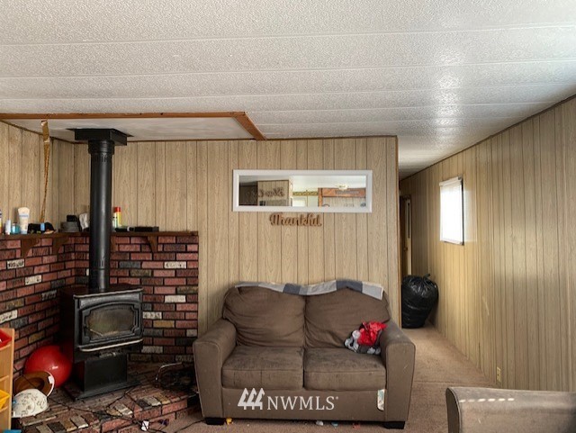 9922 180th Way Southwest Rochester, WA 98579 - Photo 8 of 15 a living room with furniture and a mirror