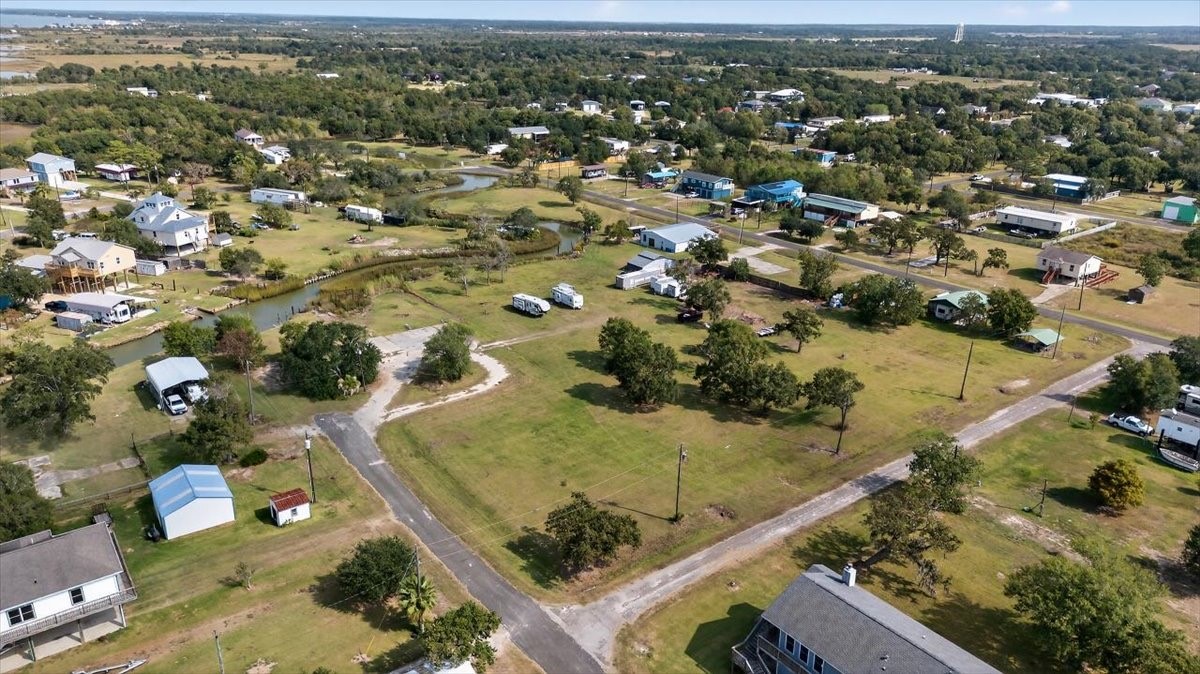 308 Spence Street Anahuac, TX 77514 - Photo 2 of 7 an aerial view of residential houses with outdoor space