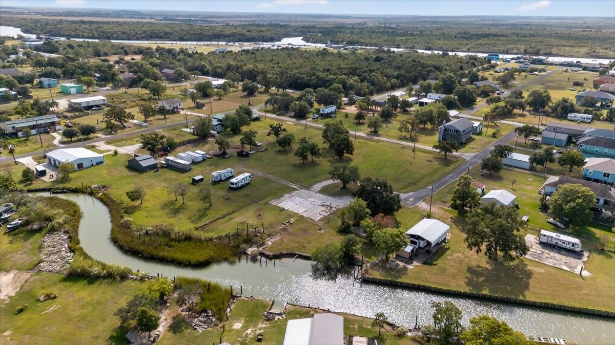 308 Spence Street Anahuac, TX 77514 - Photo 4 of 7 an aerial view of residential houses with outdoor space