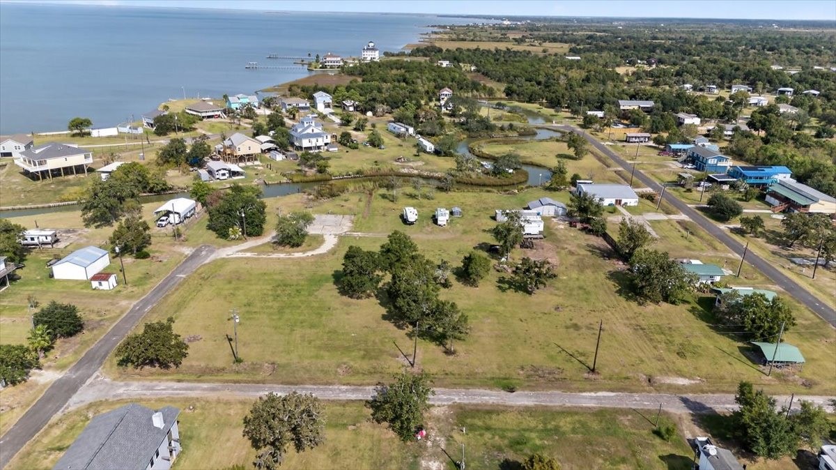 308 Spence Street Anahuac, TX 77514 - Photo 5 of 7 an aerial view of a residential houses with outdoor space