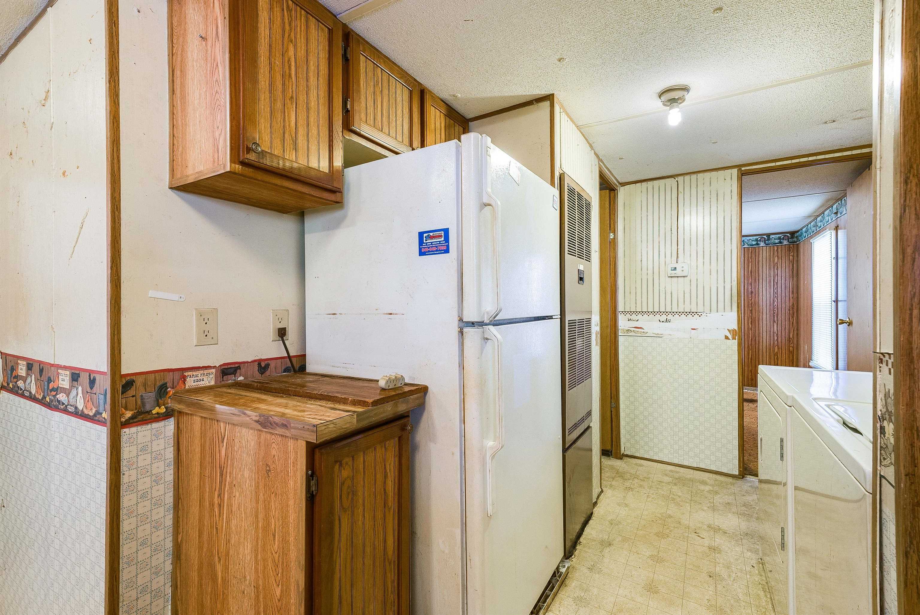 2851 Thoroughfare Road Elkton, VA 22827 - Photo 16 of 41 a kitchen with stainless steel appliances granite countertop a refrigerator and a sink