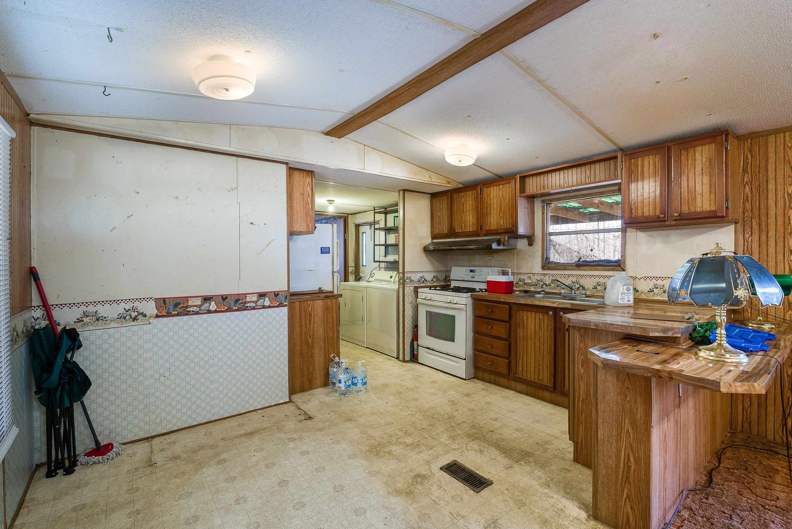 2851 Thoroughfare Road Elkton, VA 22827 - Photo 10 of 41 a kitchen with sink refrigerator and microwave