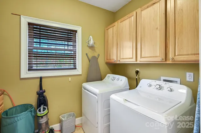 a living room with furniture pool table and a flat screen tv