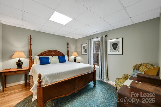 a bathroom with a toilet a sink and a mirror