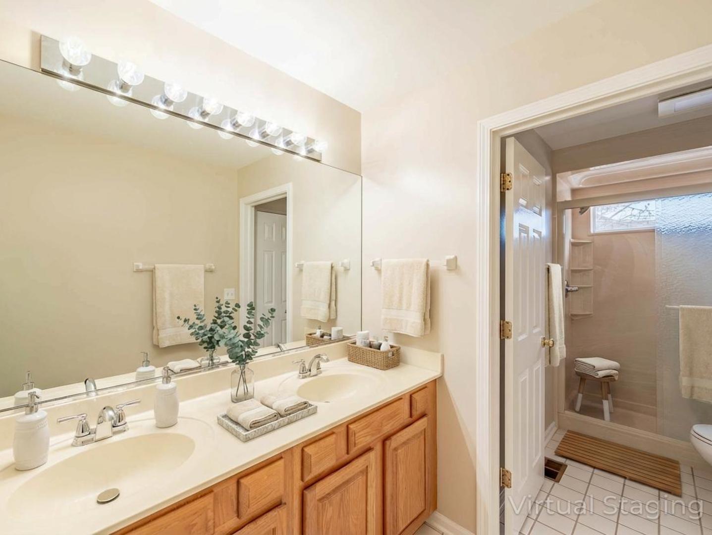 498 Capital Lane Gurnee, IL 60031 - Photo 12 of 15 a bathroom with a double vanity sink mirror and shower