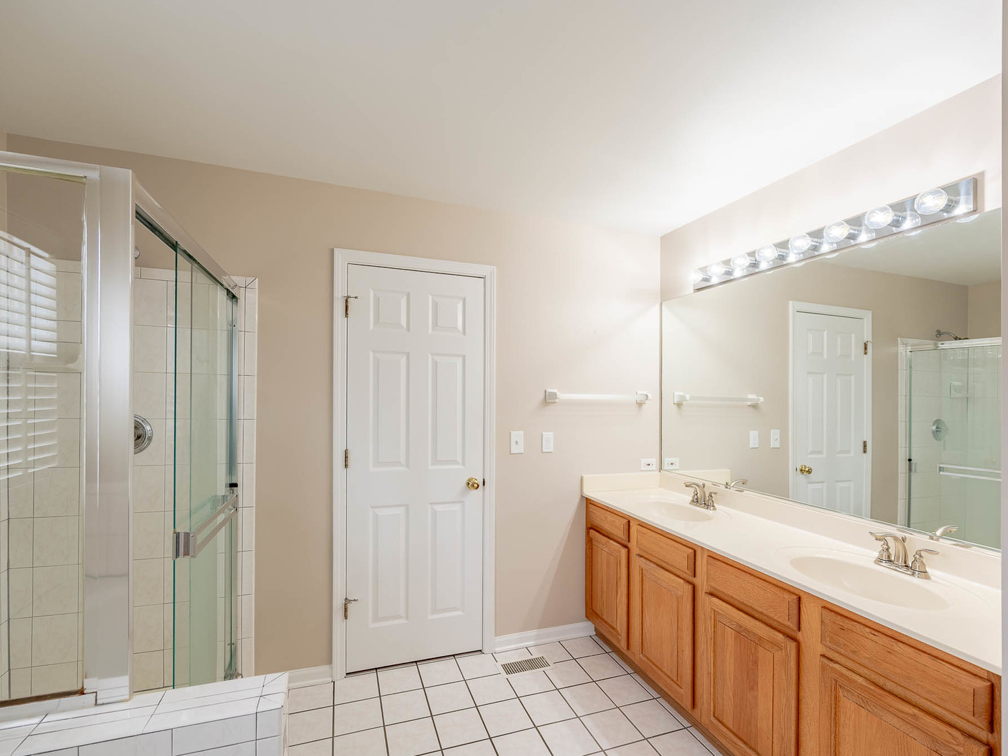 498 Capital Lane Gurnee, IL 60031 - Photo 7 of 15 a spacious bathroom with a double vanity sink mirror and shower