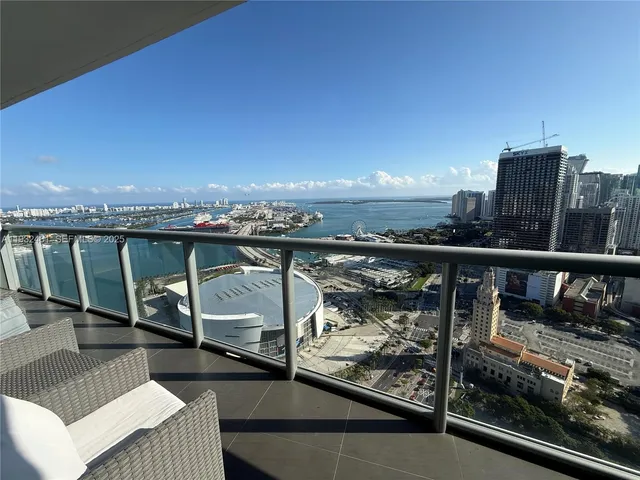 a view of a balcony with two chairs