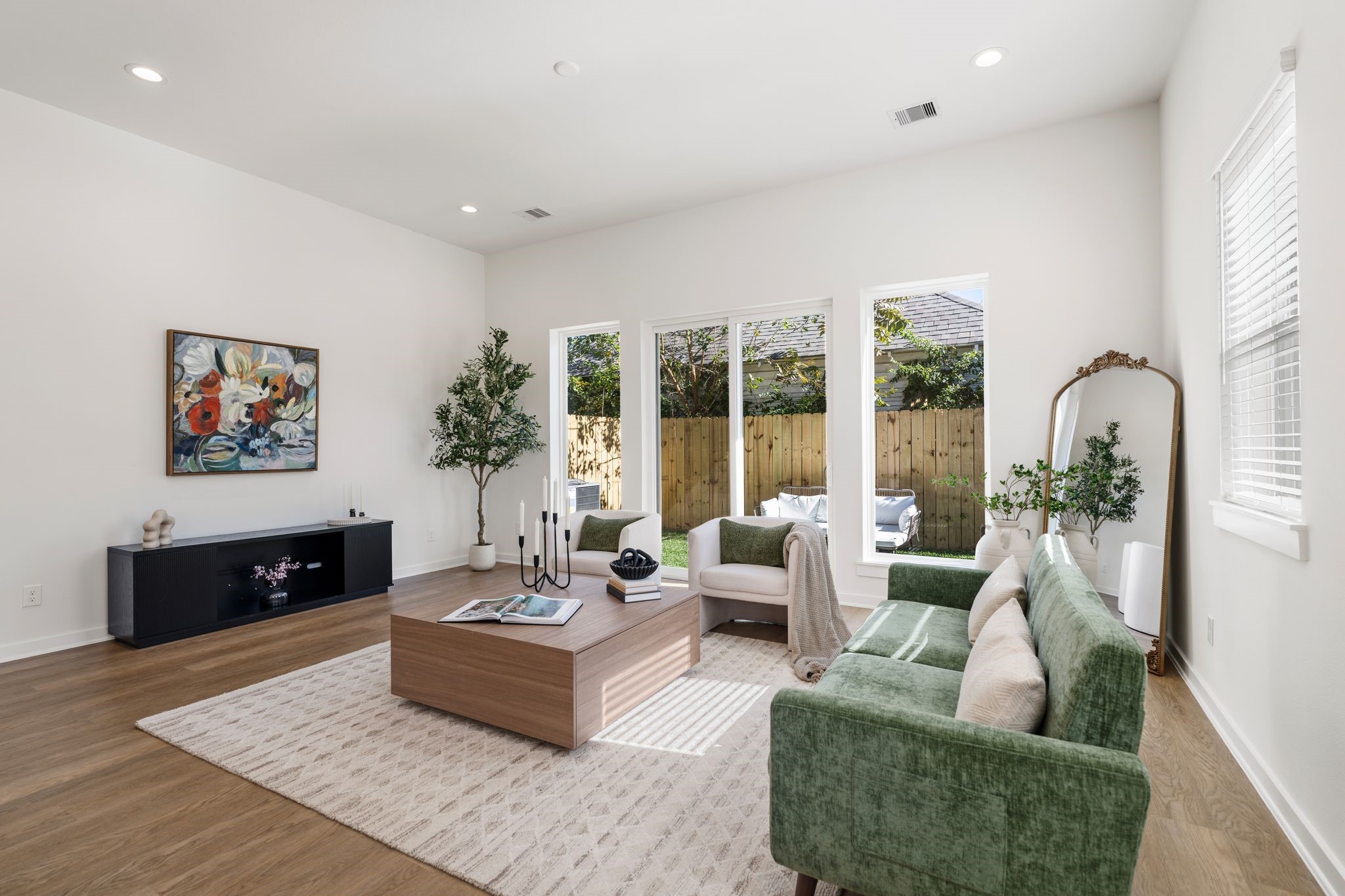 1215 Sampson Street Houston, TX 77003 - Photo 13 of 35 Surrounded by large windows creating a bright and airy atmosphere while offering beautiful views of the backyard.