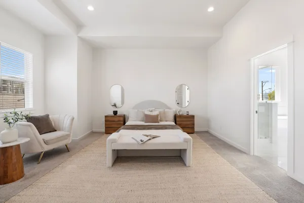 a bedroom with bed and a couch