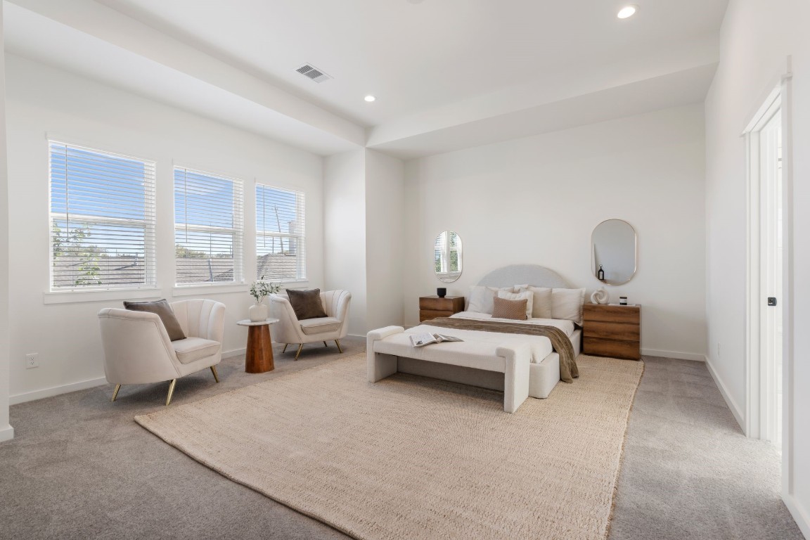 1215 Sampson Street Houston, TX 77003 - Photo 18 of 35 The primary bedroom is flooded with natural light, accentuating its high tray ceilings.