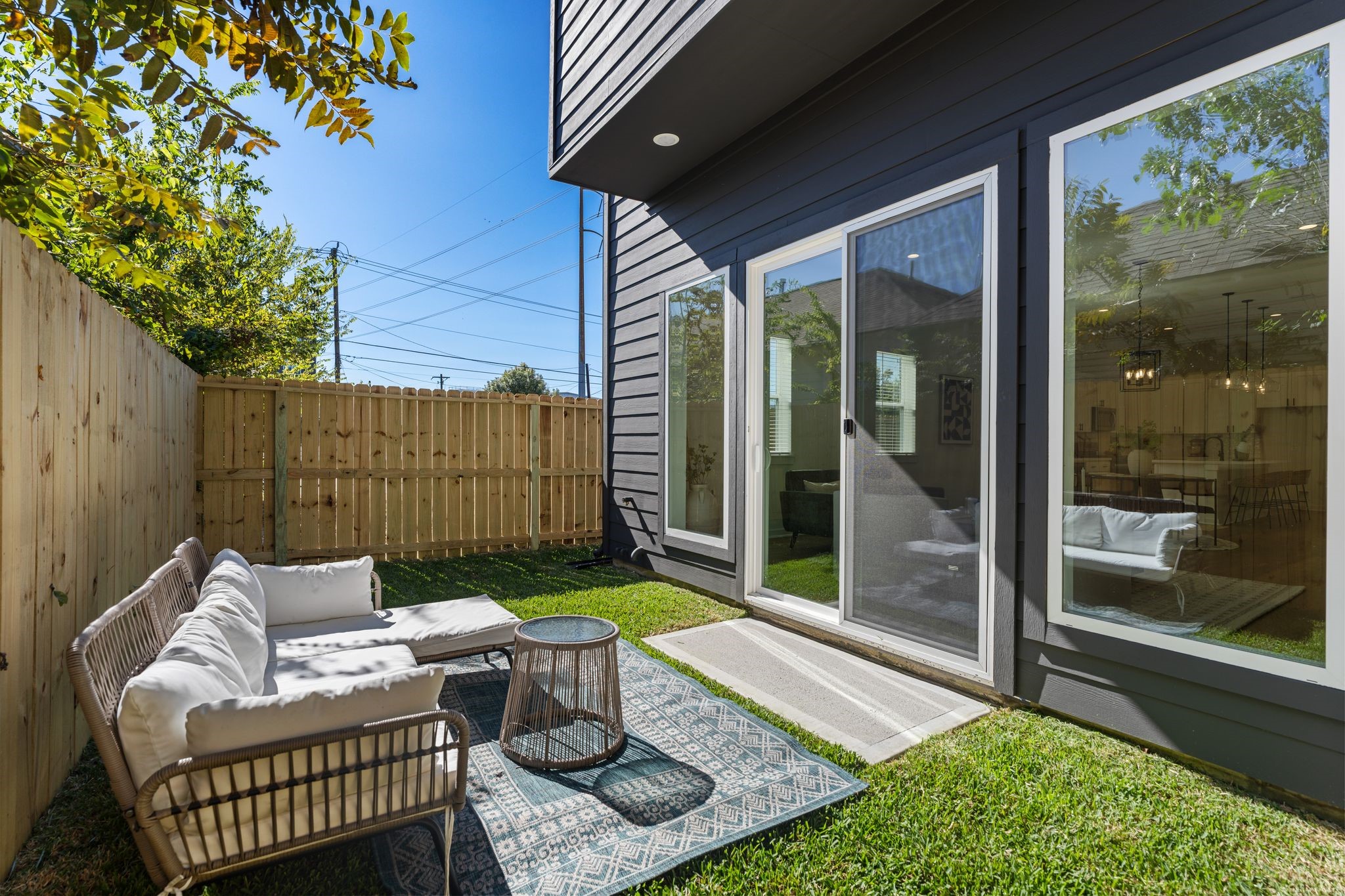 1215 Sampson Street Houston, TX 77003 - Photo 2 of 35 Private fenced in yard is a rarity in this neighborhood, accessed through sliding doors off the first floor living area that even includes a custom screen!