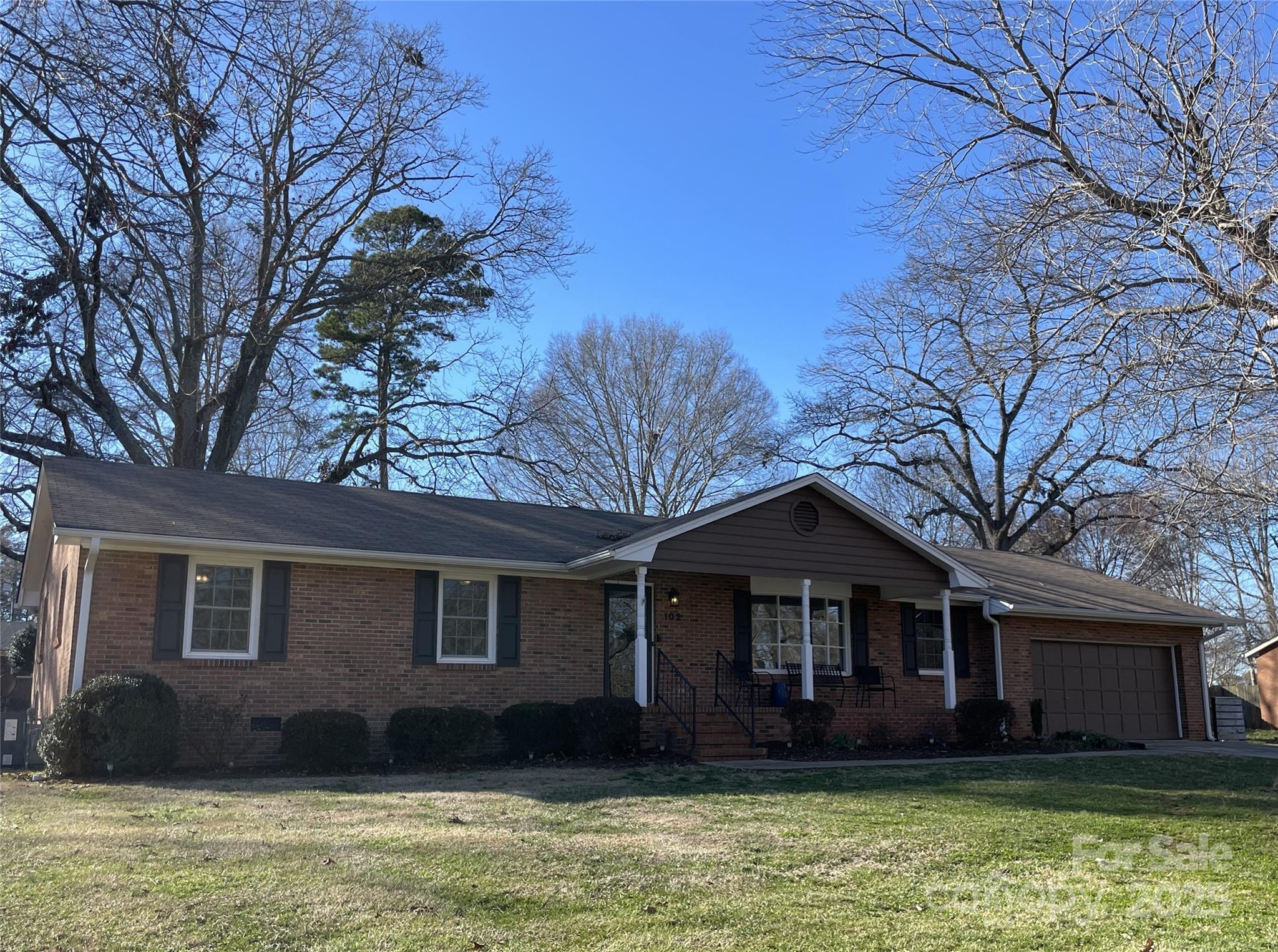 102 General Bragg Street Stanley, NC 28164 - Photo 2 of 31 a front view of a house with a garden