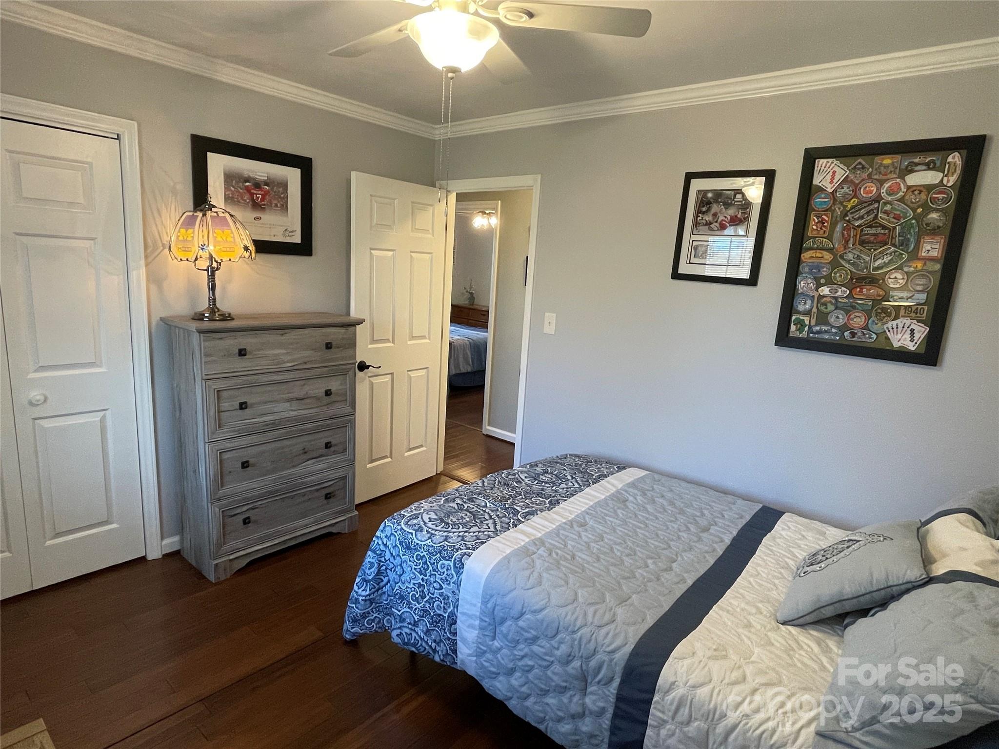 102 General Bragg Street Stanley, NC 28164 - Photo 26 of 31 a bedroom with a bed and a painting on the wall