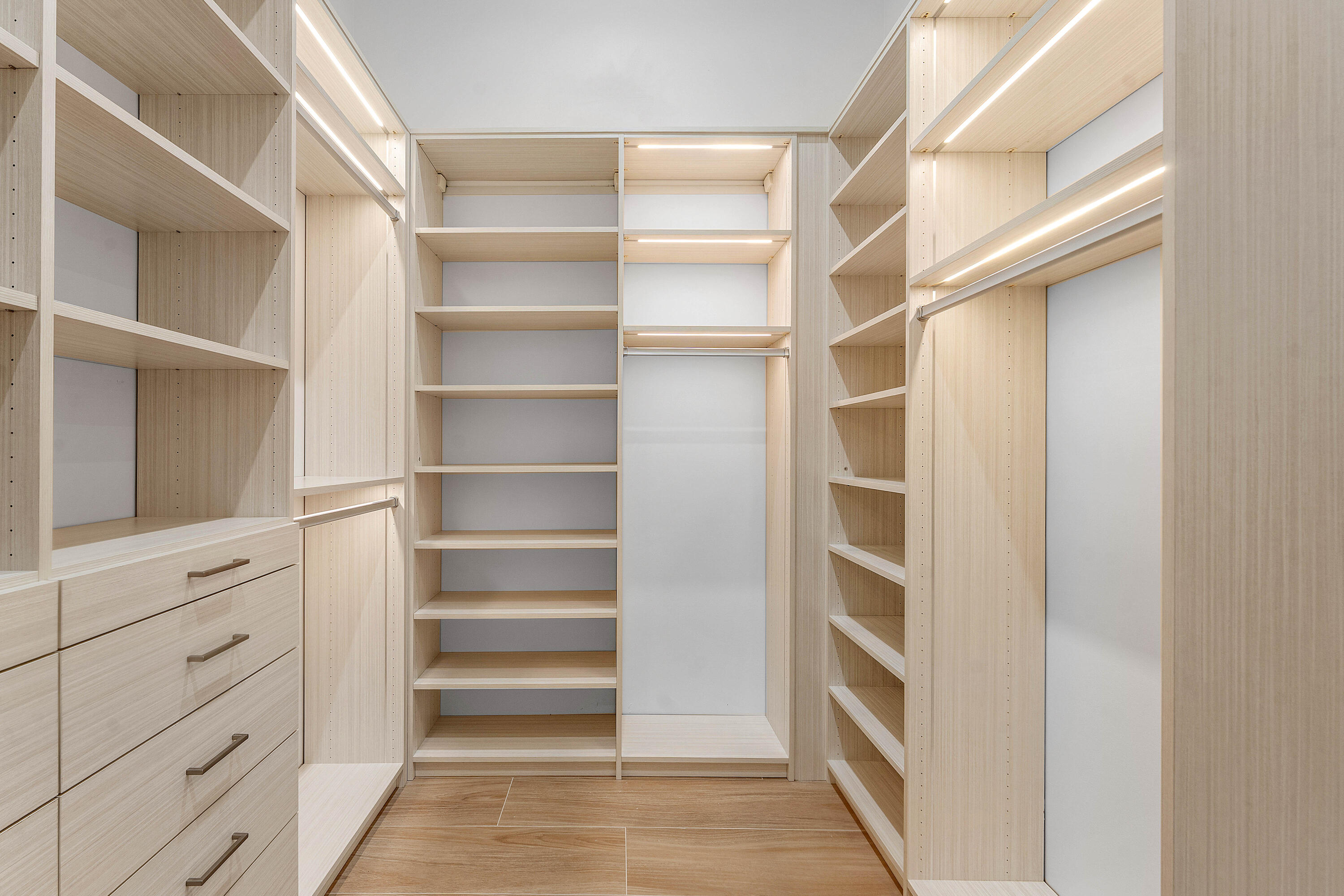 5701 Old Orange Road Jupiter, FL 33458 - Photo 27 of 46 a view of walk in closet with empty racks