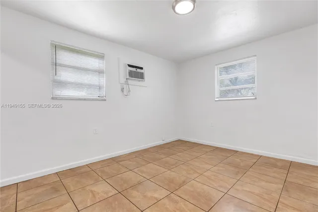 a view of an empty room and window