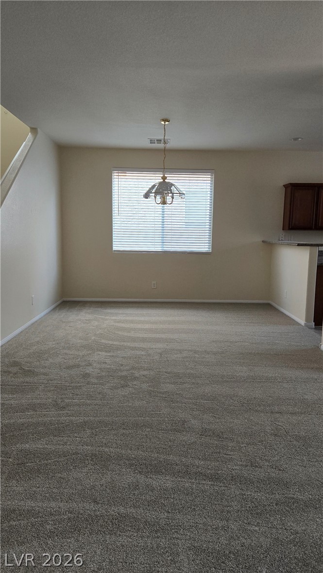 9031 Spring Star Court Las Vegas, NV 89148 - Photo 3 of 17 A spacious, neutral room offers a clean slate for personalized design.