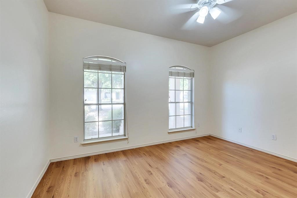 3337 Cantera Way Round Rock, TX 78681 - Photo 13 of 25 an empty room with wooden floor and windows