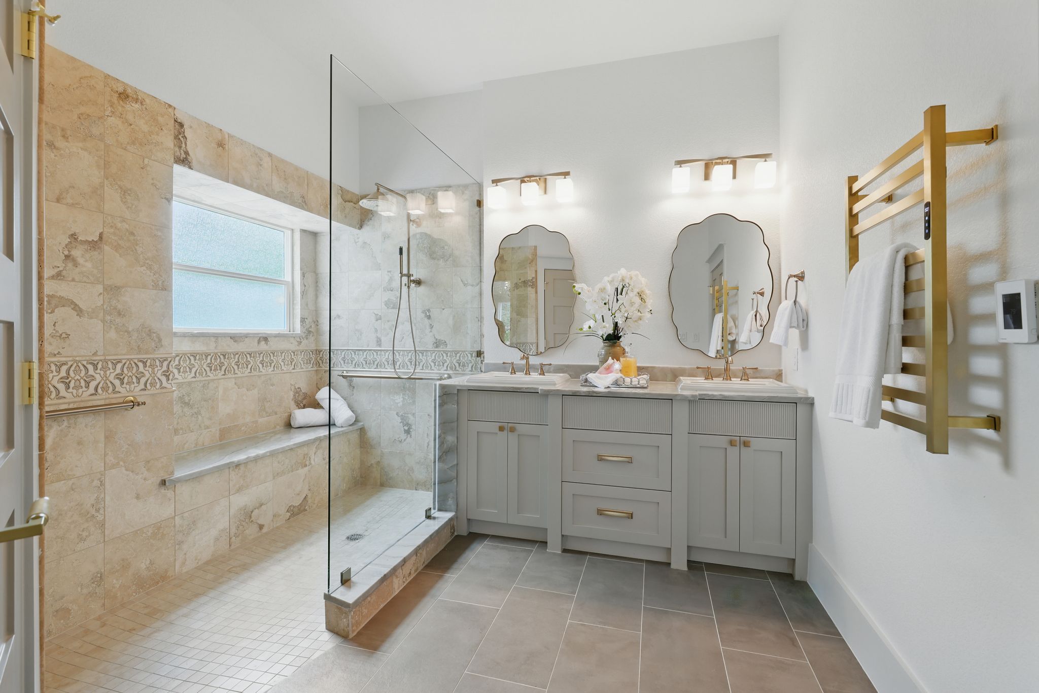 6905 Rudi Cove Austin, TX 78759 - Photo 25 of 36 Bathroom featuring walk in shower, double vanity, and tile patterned floors