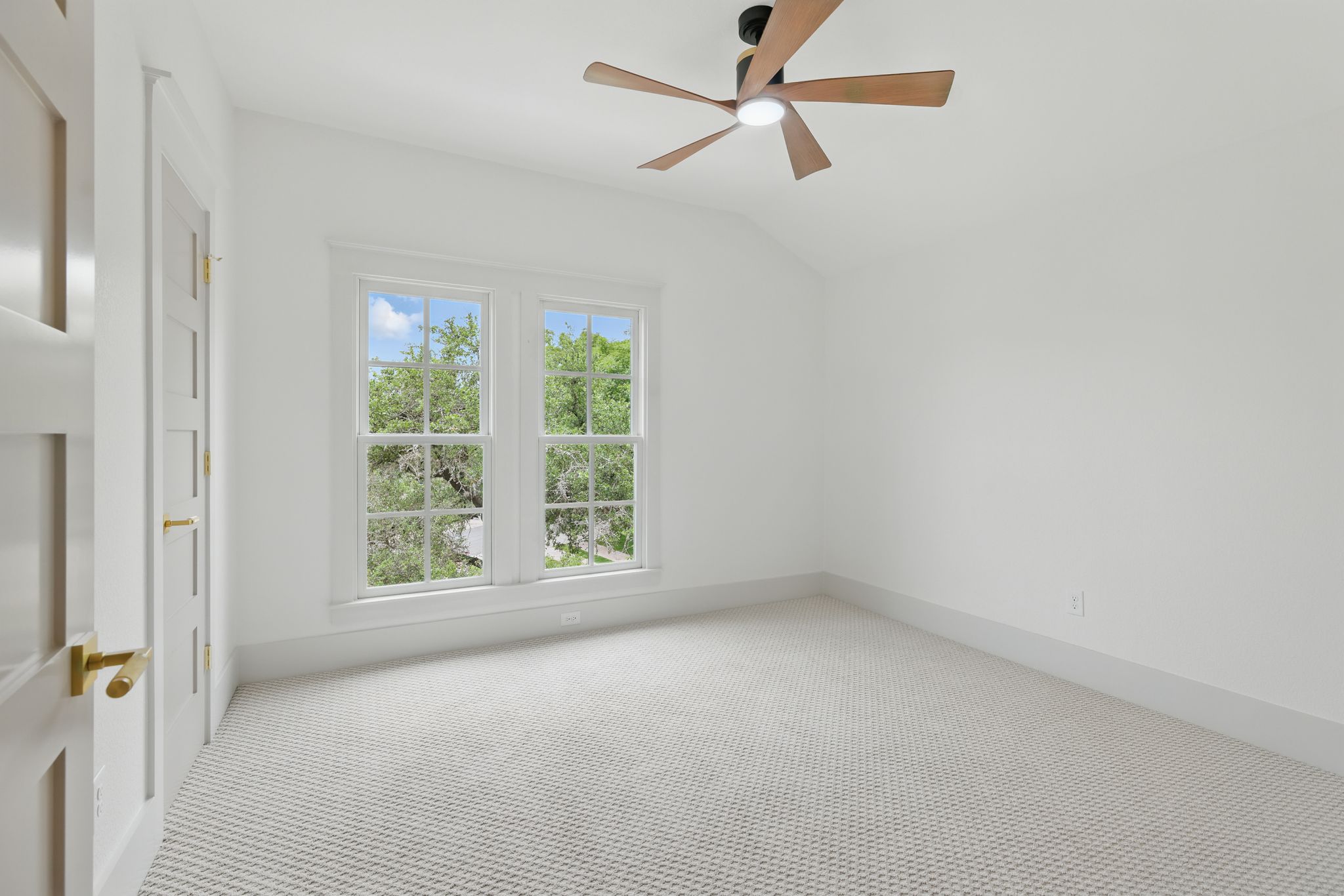 6905 Rudi Cove Austin, TX 78759 - Photo 31 of 36 Empty room featuring carpet flooring, lofted ceiling, and ceiling fan