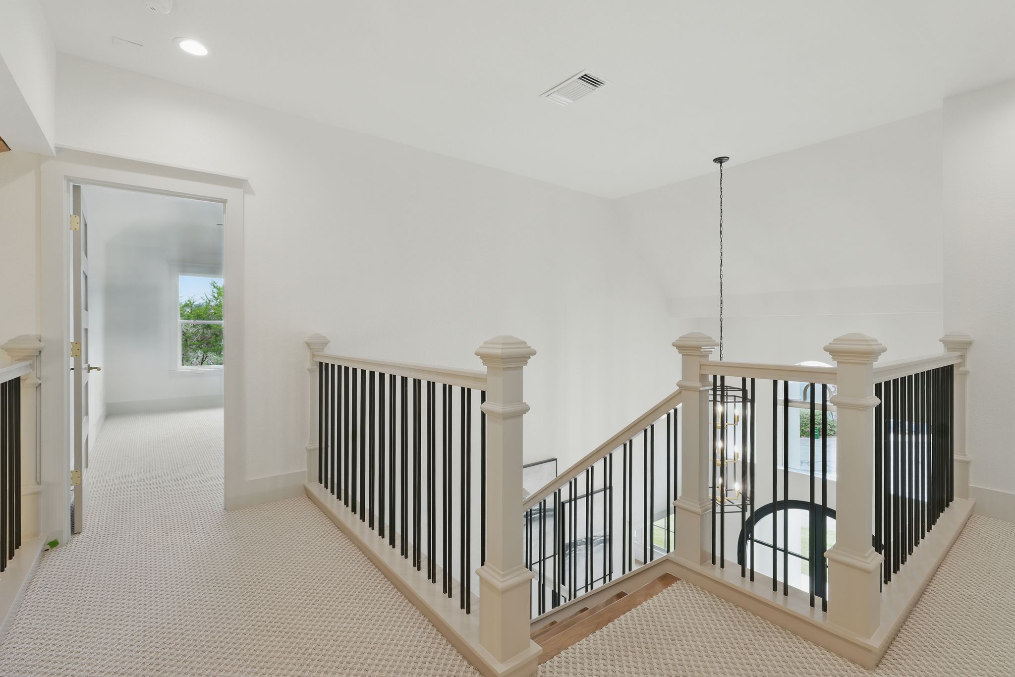 6905 Rudi Cove Austin, TX 78759 - Photo 33 of 36 Corridor with an upstairs landing, carpet floors, and recessed lighting