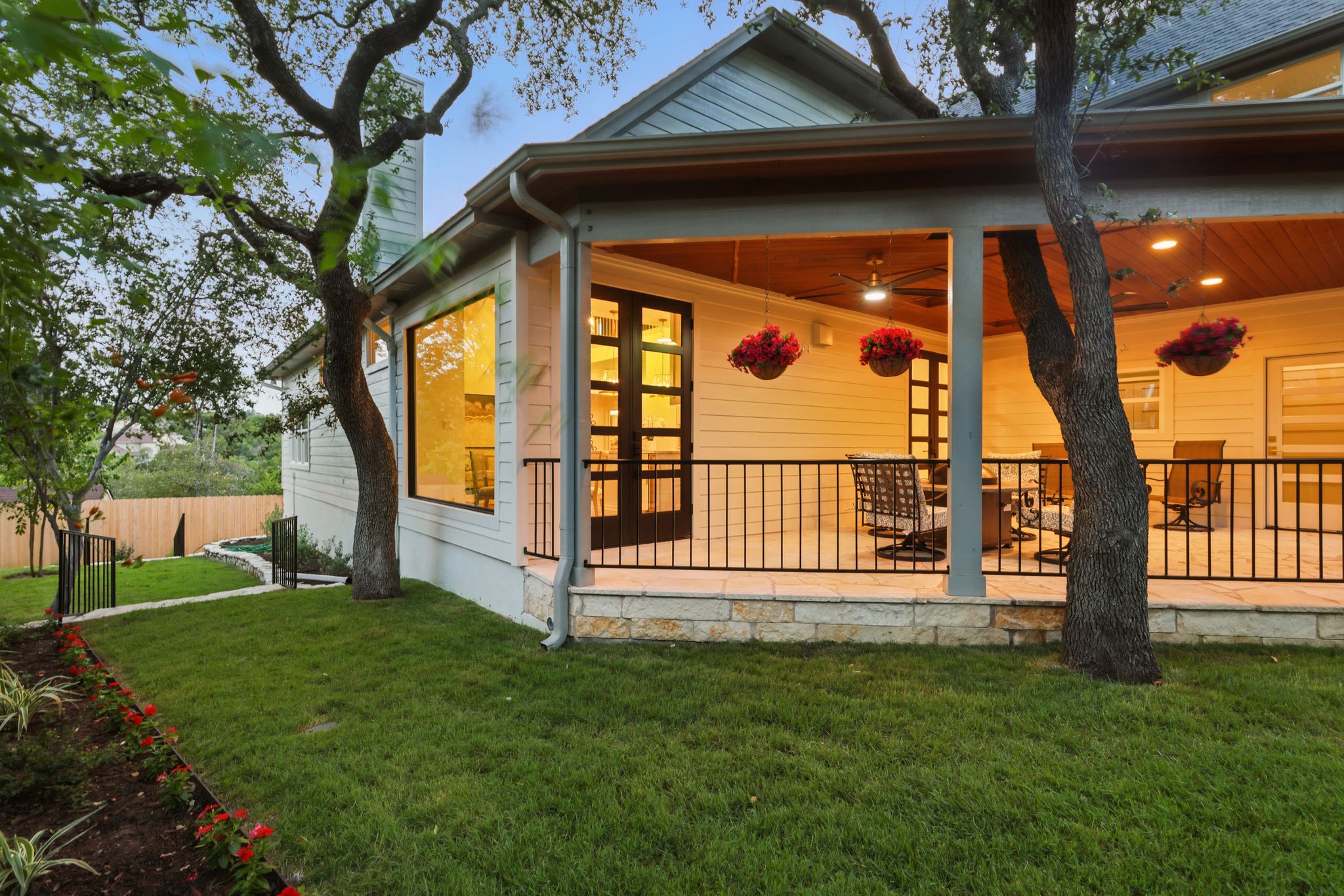 6905 Rudi Cove Austin, TX 78759 - Photo 34 of 36 Rear view of house featuring a patio area, ceiling fan, and a chimney