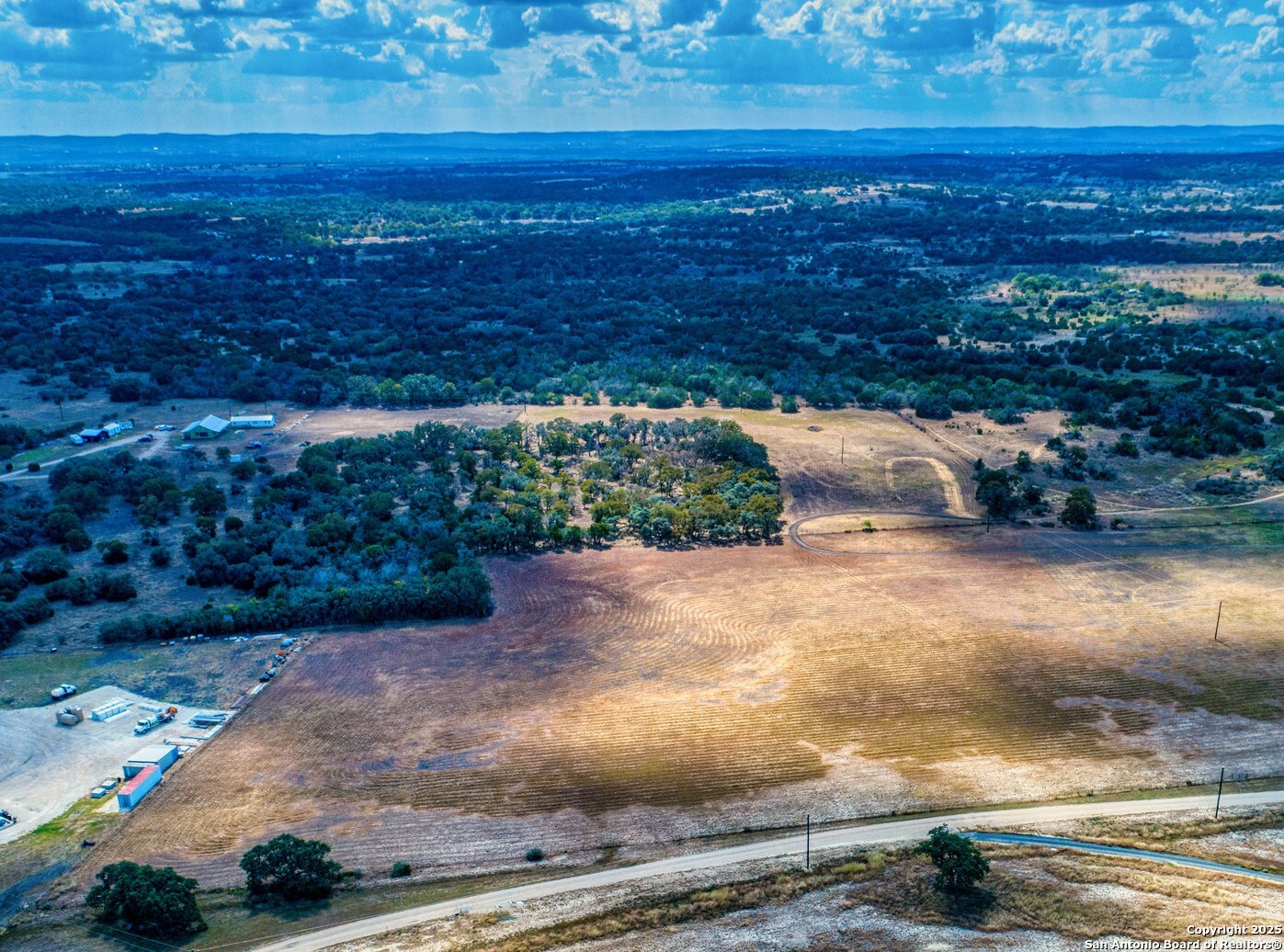 261 Watering Hole Trail Bandera, TX 78003 - Photo 19 of 24 a view of a yard with an ocean