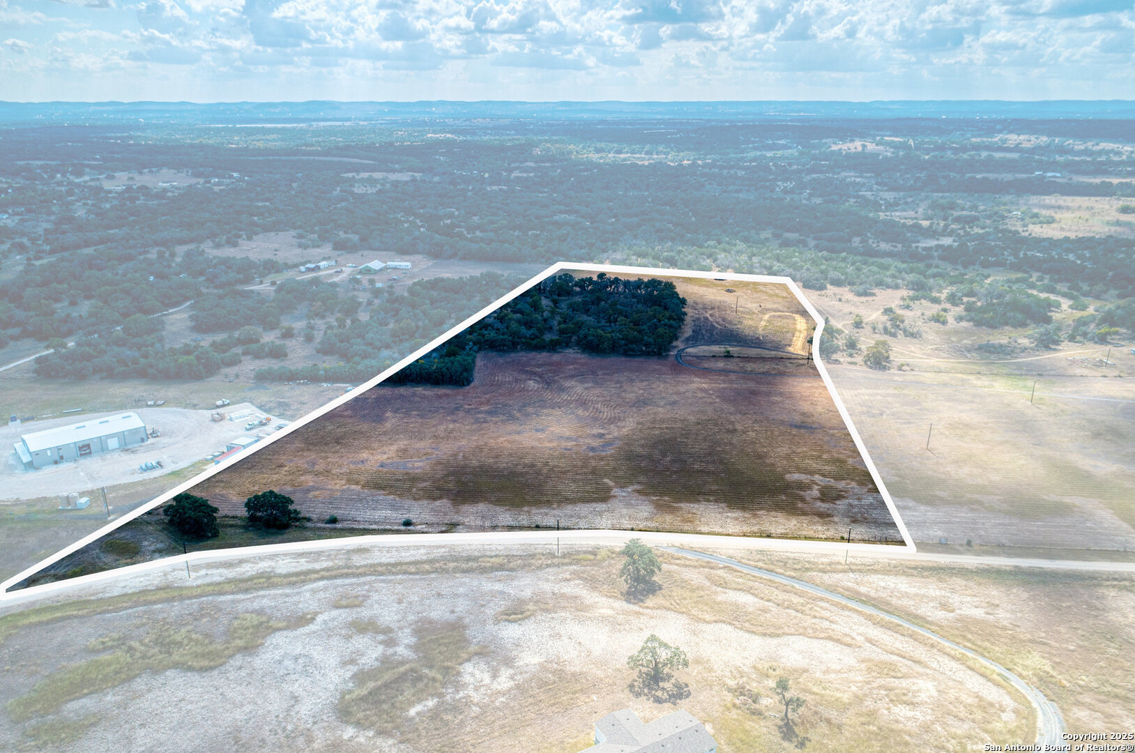 261 Watering Hole Trail Bandera, TX 78003 - Photo 20 of 24 a view of a dry yard
