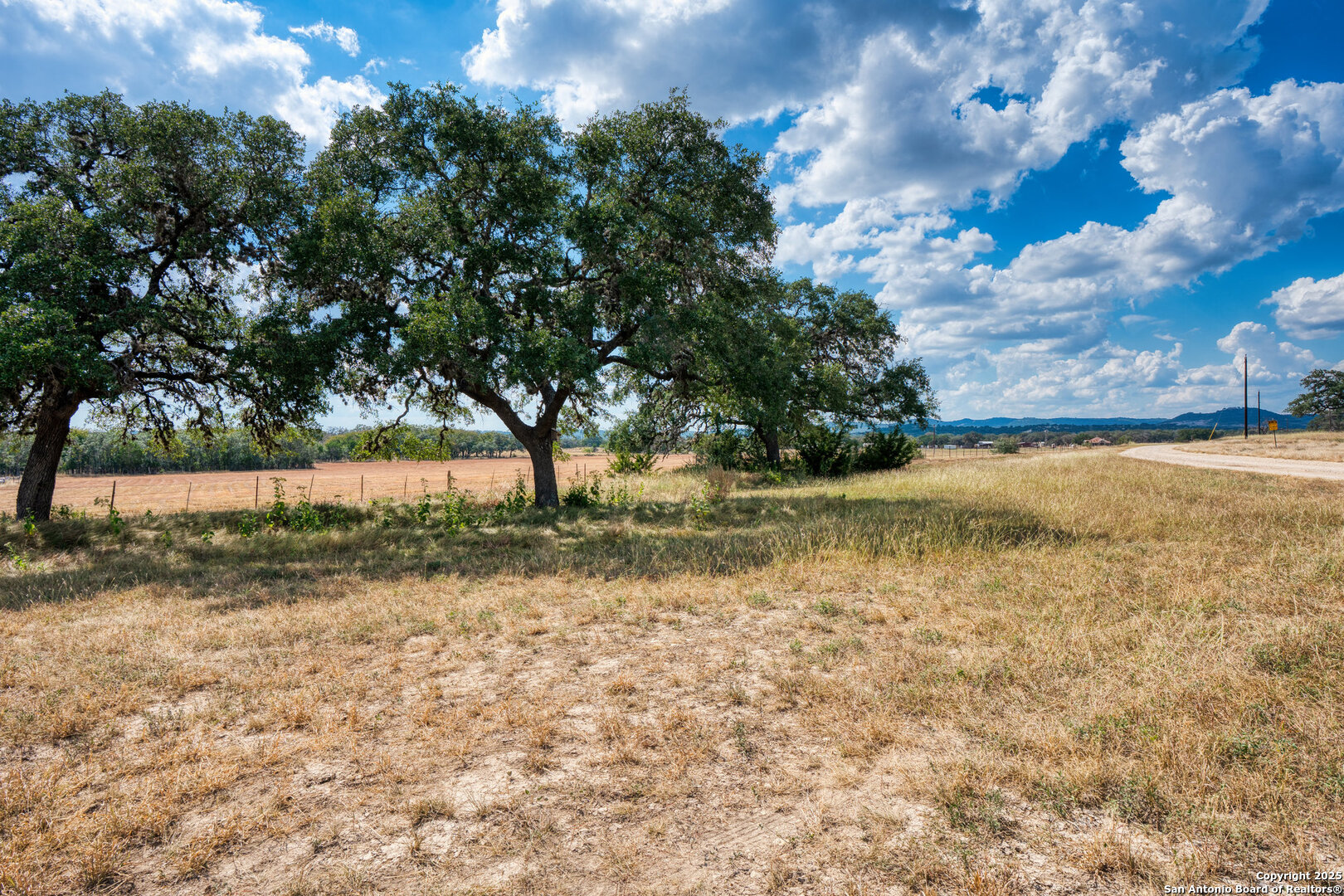 261 Watering Hole Trail Bandera, TX 78003 - Photo 2 of 24 a view of lake with outdoor space