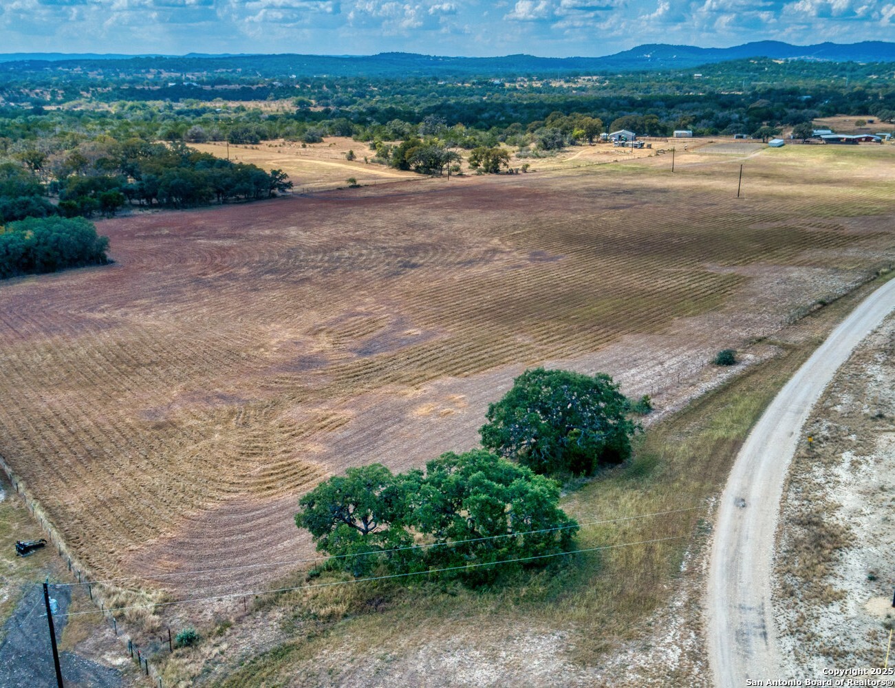 261 Watering Hole Trail Bandera, TX 78003 - Photo 6 of 24 a view of a lake with a mountain in the back